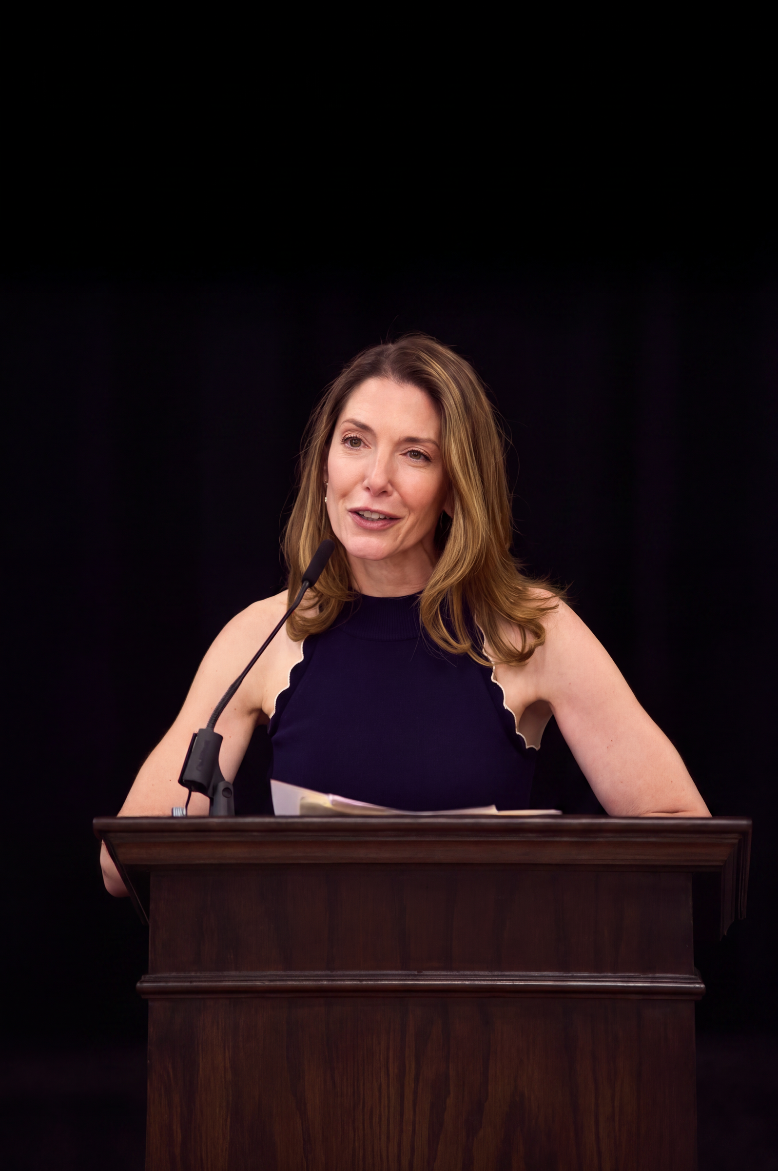 Dr. Emily Stern speaking at a podium