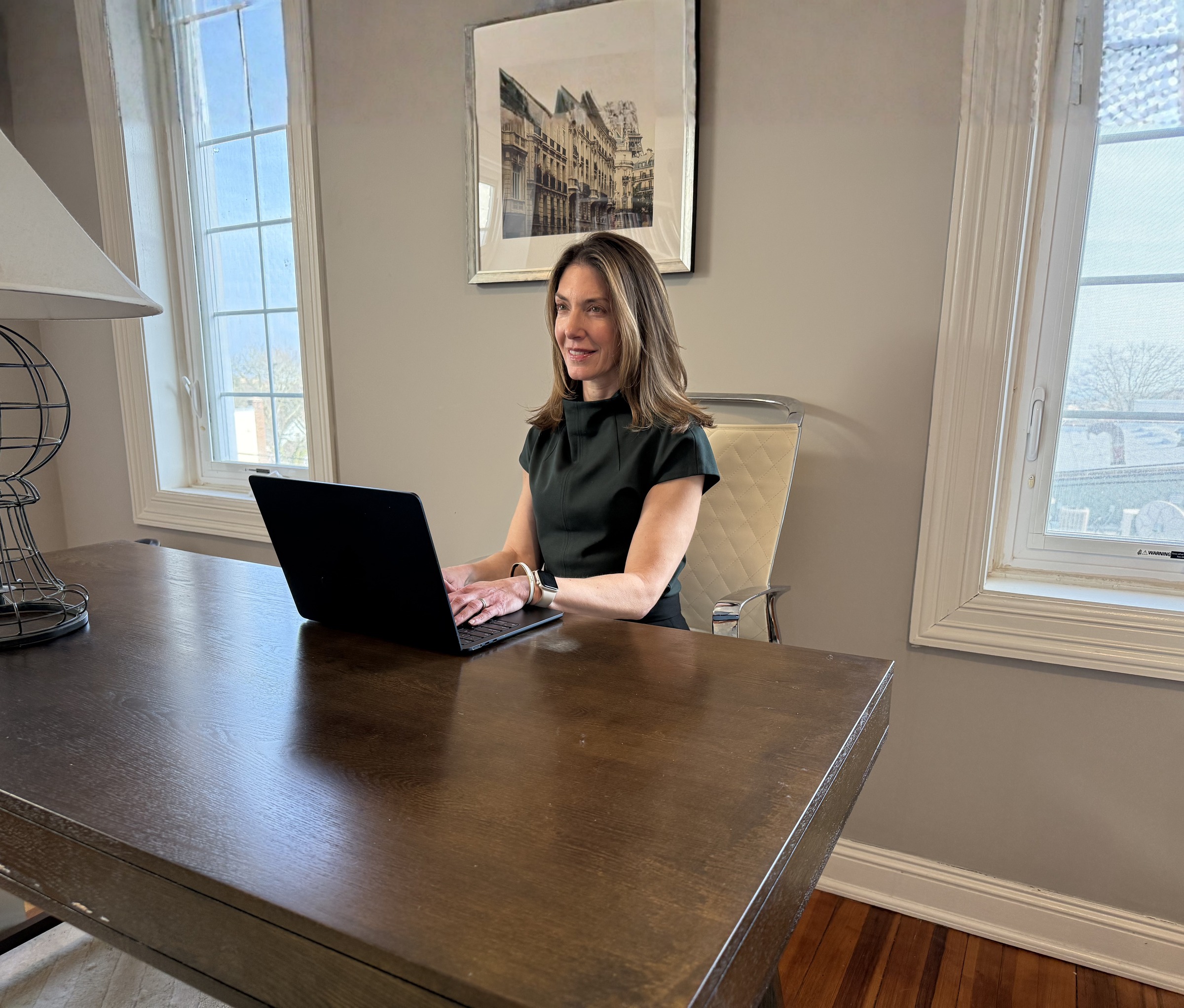 Dr. Emily Stern working at a laptop