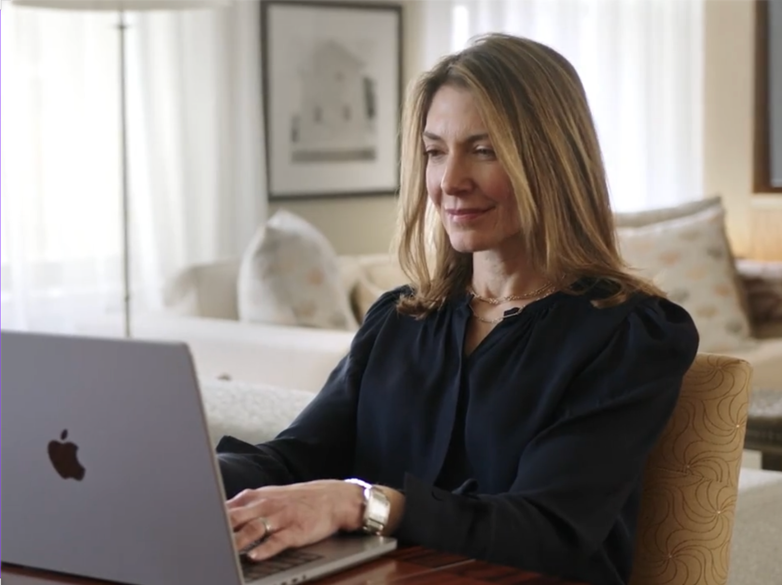 Dr. Emily Stern working on a laptop